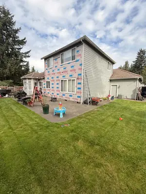 House wrap installed over the sheathing on the back of the house