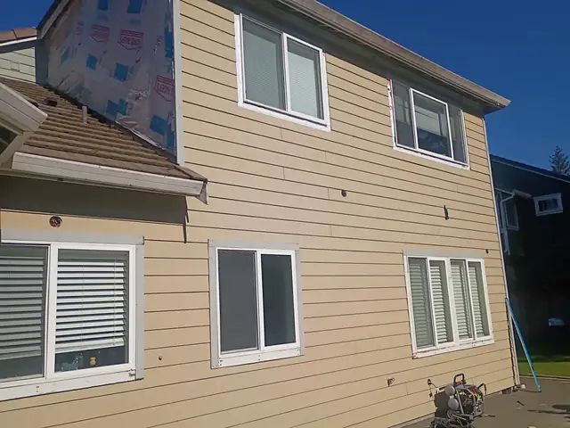 New tan lap siding on a two-story home